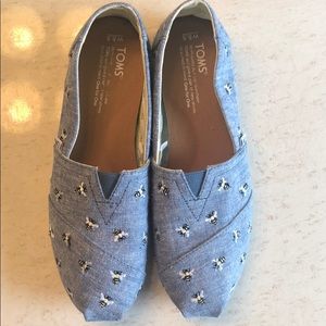 Toms Blue slip on shoes with bees